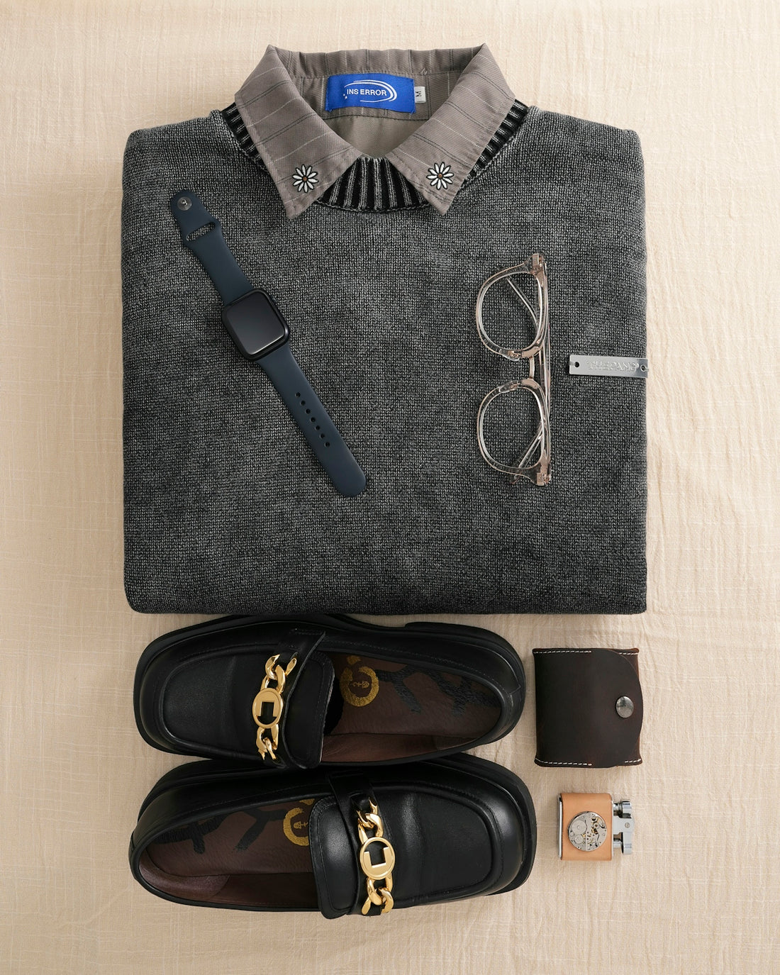 Flat lay of men's accessories and clothing