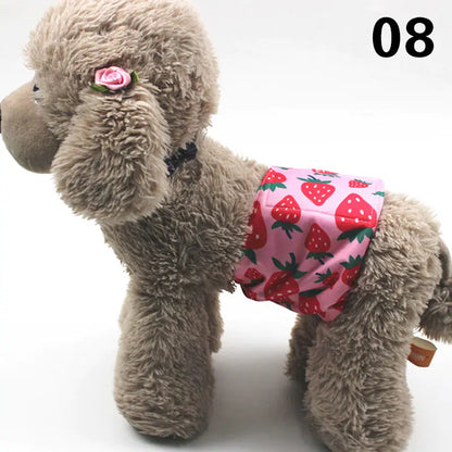 Plush gray puppy toy with a pink flower accent and wearing a strawberry-patterned diaper or underwear. The image showcases the cute, fuzzy puppy toy and its whimsical accessories.