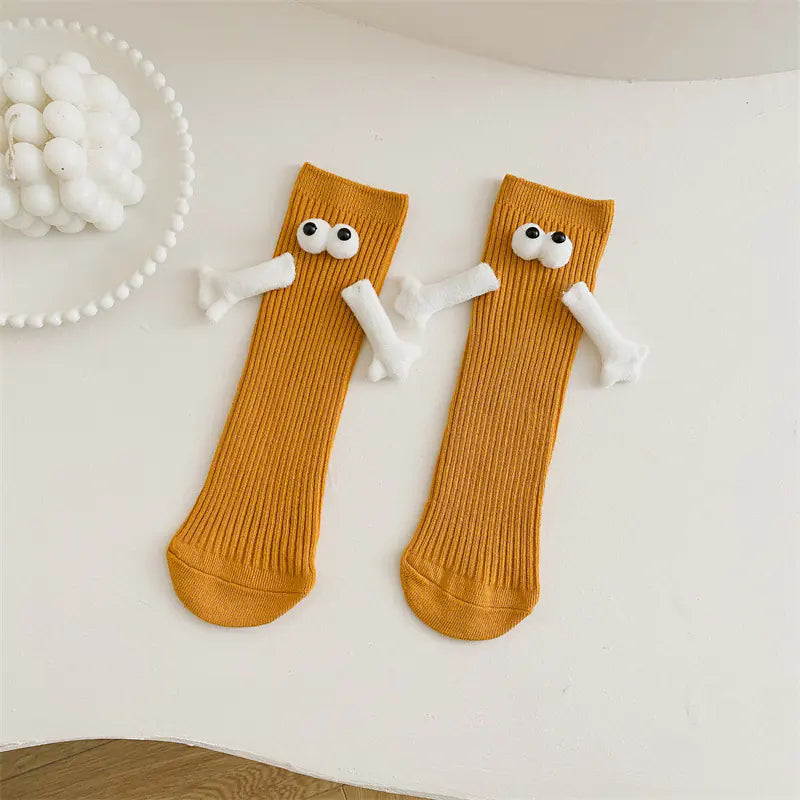 Cute solid color kids' mid-calf socks with playful eyes and bones from naiveniche's Cuisine collection.