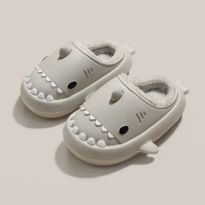 Cute kids' shark-themed plush slippers with a thick, waterproof bottom from the naiveniche brand