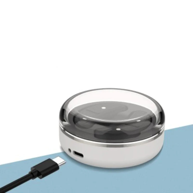 Sleek eye massager with USB charging port. This compact and modern device features a smooth, curved design to gently soothe and relax the eye area.