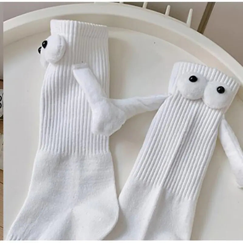 Cozy white mid-calf socks with playful eyes, ideal for parents and kids.