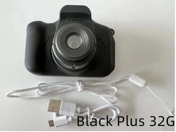 Compact kids camera in black with USB charging cable and 32GB storage