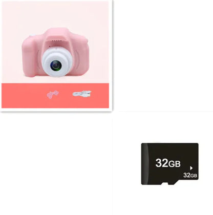 Compact pink kids camera with large lens, accompanied by a 32GB memory card for capturing precious moments.