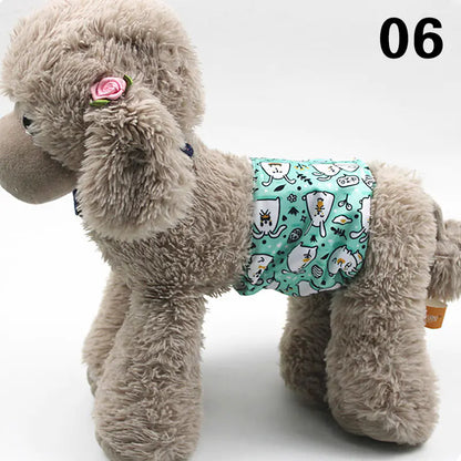 Plush gray dog toy wearing a patterned pet diaper or pad for incontinence protection, placed on a plain white background.