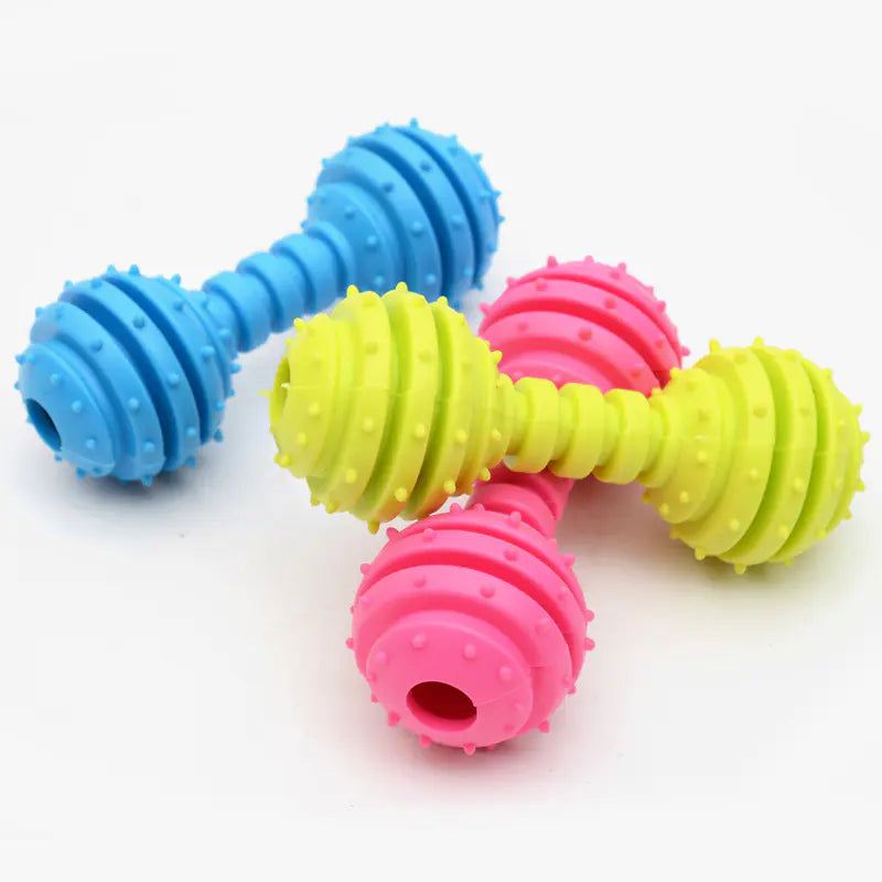 Colorful rubber pet toys: Vibrant dumbbell-shaped chew toys in blue, yellow, and pink for active pets.