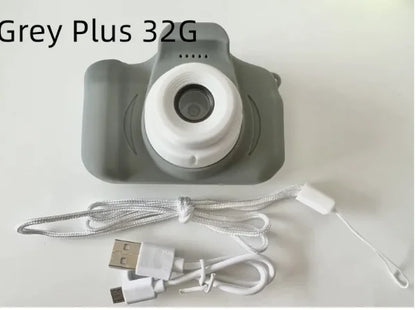 Compact kids' camera in grey with 32GB storage and USB charging cable
