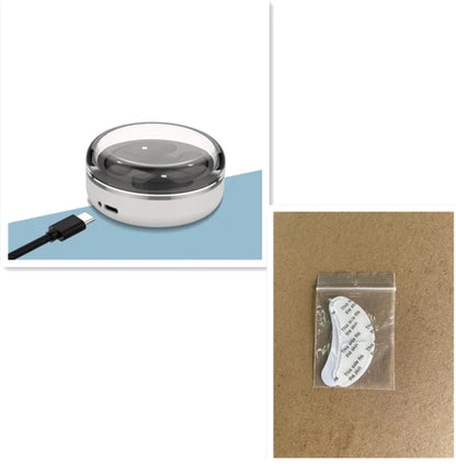 Compact eye beauty device with USB charging on a blue surface, accompanied by a packaged accessory.