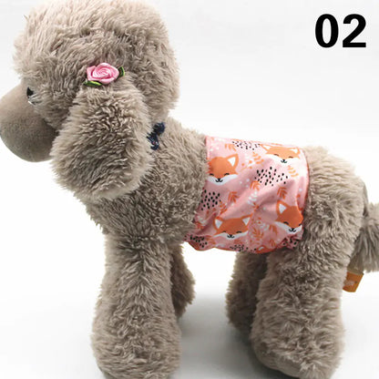Plush gray puppy with a pink rose accent, wearing a colorful patterned diaper or pet cover. The image shows the product placement of the absorbent pet pad or cover against a plain white background.